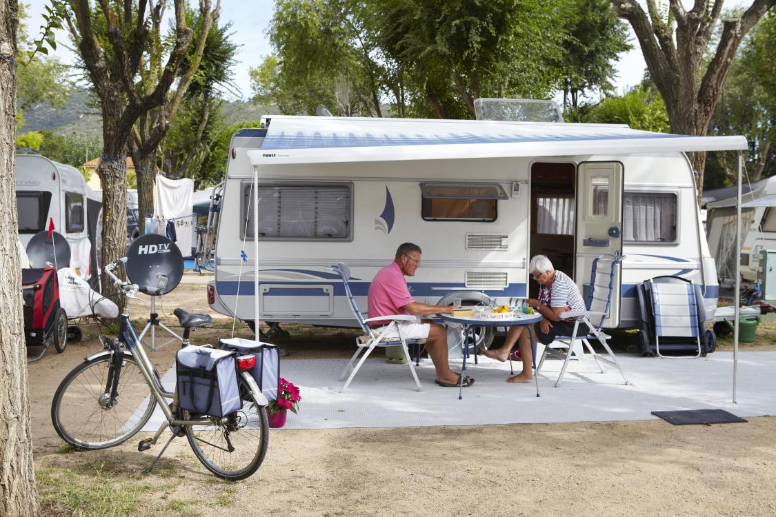 Couple eating at a trailer park in Spain